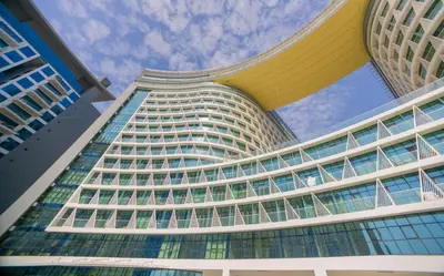 a tall building with a lot of windows at Studio with private beach access at Palm Jumeirah in Dubai