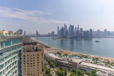 a view of a city with a river and buildings at Studio with private beach access at Palm Jumeirah in Dubai