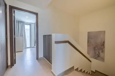 a hallway with a staircase in a house at Exclusive Spacious Villa I Garden I Maid Room in Dubai