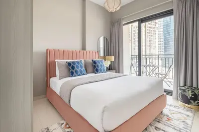 a bedroom with a bed with a large window at Frank Porter - Zada Tower in Dubai