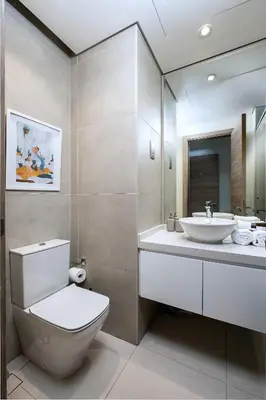 a bathroom with a toilet and a sink and a mirror at Studio With Best View Of Dubai in Dubai