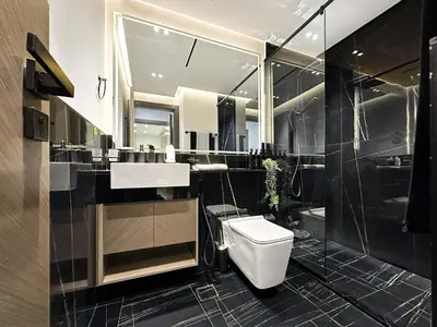 a bathroom with a toilet and a sink and a shower at Trophy Lux Suite With Garden Balcony and Burj Khalifa Views in Dubai