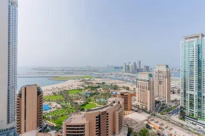 an aerial view of a city with tall buildings at Newly Designed 3 beds w marina eye view in Dubai