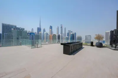 a large rooftop with a view of a city skyline at Urban Skyline City Comfort Studio in Dubai