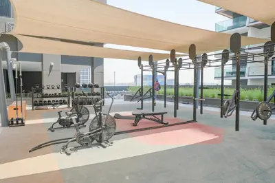a gym with bikes on a bike rack in a building at Urban Skyline City Comfort Studio in Dubai
