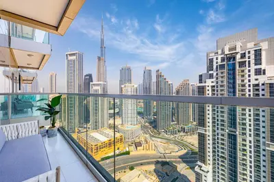 a balcony with a view of a city skyline at Daniels Burj Khalifa View 2BR at Paramount Midtown in Dubai