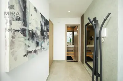 a hallway with a large painting on the wall at Mira Holiday Homes - Stylish 1 bedroom in Dubai Marina in Dubai