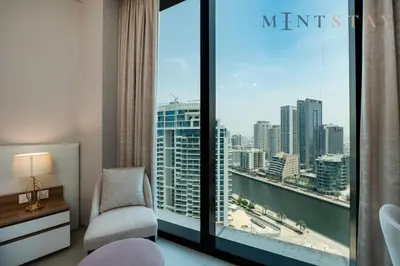 a room with a window with a view of a city at Address JBR Marina Views, Address Beach Resort Residence, Dubai Marina - Mint Stay in Dubai