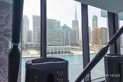 a view of a city skyline from a window at LUX The Modern Binghatti Canal Suite in Dubai
