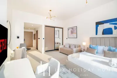 a living room with a bed and a couch at LUX The Modern Binghatti Canal Suite in Dubai