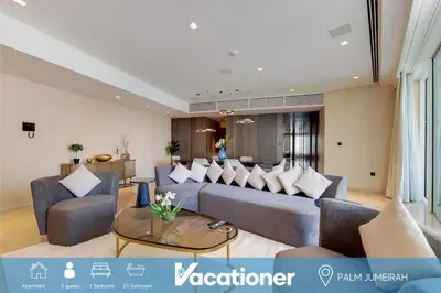 a living room with a couch and chairs and a table at FIVE Palm North Residences - Spectacular Three Bedroom in Dubai