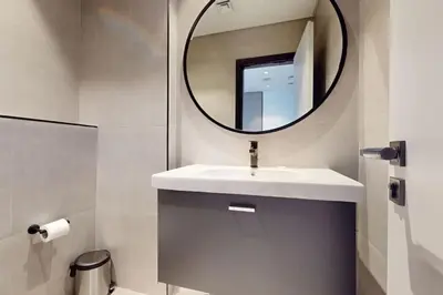 a bathroom with a sink and a mirror at 15 Northside Tower 2 - Spacious One Bedroom in Dubai