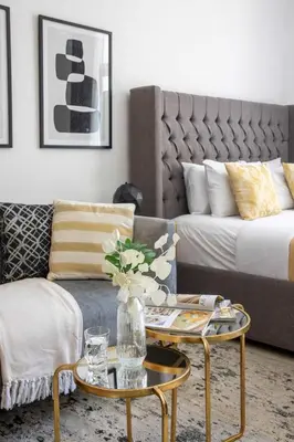 a living room with a couch and a coffee table at Frank Porter - Claren Tower in Dubai