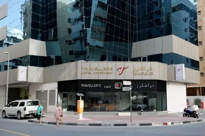 a building with people walking in front of it at Beautiful Partition Room in Al barsha 1 Near Metro in Dubai