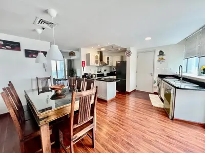 a kitchen and dining room with a table and chairs at The Waves 241 Dubai Marina in Dubai