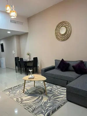 a living room with a couch and a table at SEASONING STAY AT DUBA MARINA in Dubai