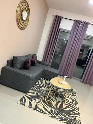 a living room with a couch and a table at SEASONING STAY AT DUBA MARINA in Dubai