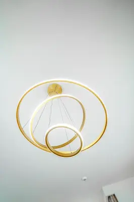 a ceiling light with a gold ring on it at New Arabian Dubai Hills villa- 3 BR & Maid Golf Grove With Private pool in Dubai