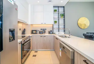 a kitchen with a sink and a counter at New Arabian Dubai Hills villa- 3 BR & Maid Golf Grove With Private pool in Dubai