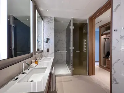 a bathroom with two sinks and a shower at Address Residence Dubai Opera 21 by Luxstay Holiday Homes in Dubai