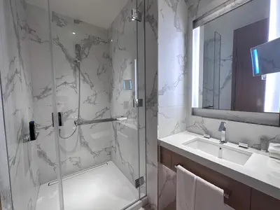 a bathroom with a shower and a sink at Address Residence Dubai Opera 21 by Luxstay Holiday Homes in Dubai