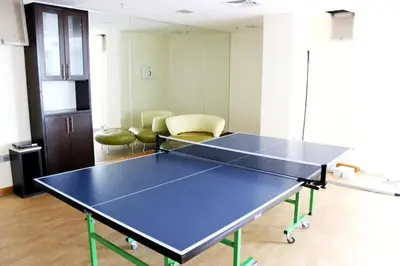 a ping pong table in the middle of a room at Very nice studio in Skyview Tower Dubai Marina in Dubai