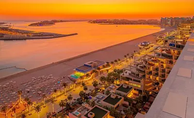 an aerial view of a city with a beach at Palm Jumeirah Paradise- Luxury,Unveiled in Dubai
