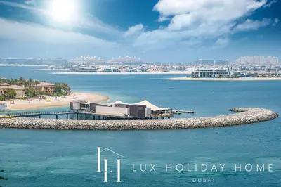 a view of a body of water with a beach at LUX The Beachfront Island View Suite in Dubai