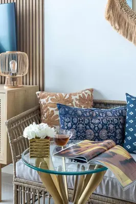 a living room with a glass table in front of a couch at Frank Porter - Seven Hotel & Aprtments in Dubai