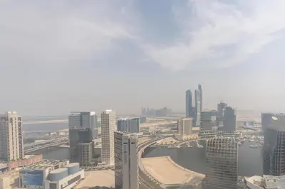 an aerial view of a city with tall buildings at Lux BnB Upper Crest Tower I Skyline Views in Dubai