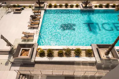 an overhead view of a swimming pool in a building at Daniels Cozy Studio at JVC in Dubai