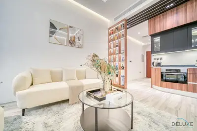 a living room with a couch and a table at Modern 1BR at Marina Park Dubai Marina by Deluxe Holiday Homes in Dubai