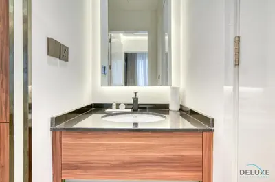 a bathroom with a sink and a mirror at Modern 1BR at Marina Park Dubai Marina by Deluxe Holiday Homes in Dubai
