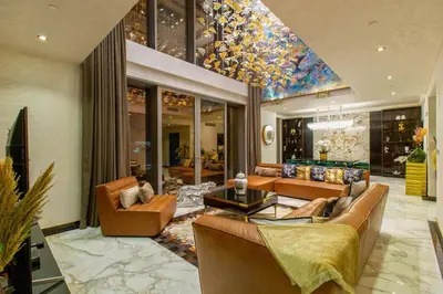 a large living room with couches and a pool table at Triplex Paradise Penthouse in Dubai