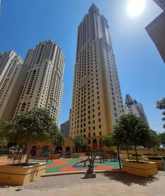 a view of three tall buildings in a city at La buena vida holiday homes - Deluxe 3 bedroom apartment on the beach in Dubai