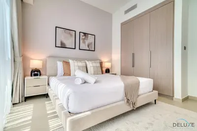 a bedroom with a large white bed in a room at Sumptuous 1BR at Act One Act Two Tower 1 Downtown Dubai by Deluxe Holiday Homes in Dubai