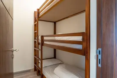a couple of bunk beds in a room at Downtown 3BR Luxe, Burj & Fountain View Bliss Near Dubai Mall in Dubai