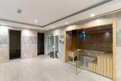 a room with a shower and a glass wall at Group Stay I Near Dubai Mall I Family friendly in Dubai