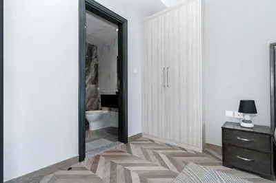 a bathroom with a mirror and a sink and a toilet at Group Stay I Near Dubai Mall I Family friendly in Dubai
