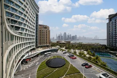 a view of a city with buildings and a street at Chic Palm Studio with Sea View & Infinity Pool in Dubai