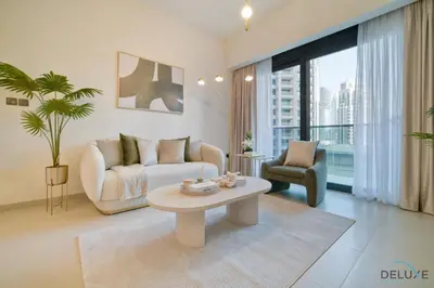 a living room with a couch and a table at Plush 1BR at Act One Act Two Tower 2 Downtown Dubai by Deluxe Holiday Homes in Dubai