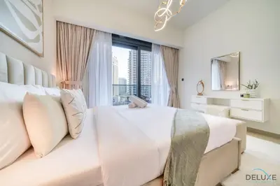 a bedroom with a large bed with a large window at Plush 1BR at Act One Act Two Tower 2 Downtown Dubai by Deluxe Holiday Homes in Dubai