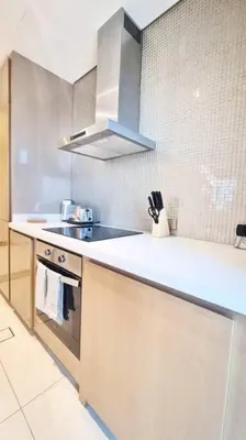 a kitchen with a sink and a counter top at Luxury Paramount Hotel Apt B666 in Dubai