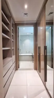 a bathroom with a walk in shower and a bath room at Luxury Paramount Hotel Apt B666 in Dubai