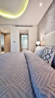 a bedroom with a large bed in a room at Luxury Paramount Hotel Apt B327 in Dubai