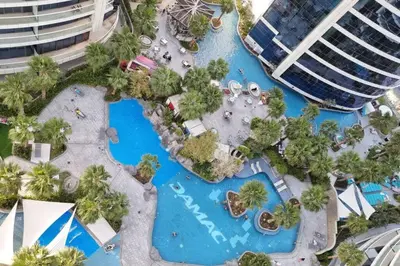 an aerial view of a pool at a resort at Luxury Paramount Hotel Apt B327 in Dubai
