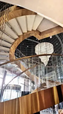 a spiral staircase in a building with a ceiling at Luxury Paramount Hotel Apt B327 in Dubai
