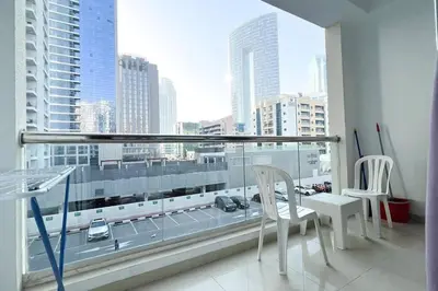 a room with a large window with a view of a city at StoneTree - DEC Tower 2 Studio - Dubai Marina in Dubai