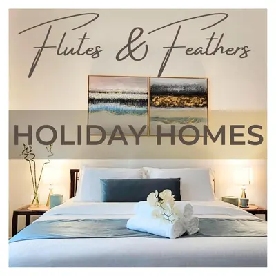 a bedroom with a bed with the words lifts and feelings holiday homes at Dubai Marina,JBR -Luxurious 2 BR King Suite in Dubai