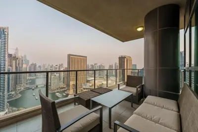 a balcony with a view of a city skyline at Maison Privee - Dreamy Apt with Jaw-Dropping Marina Views in Dubai
